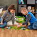 Boy and girl playing John Deere Themed Checkers Board Game